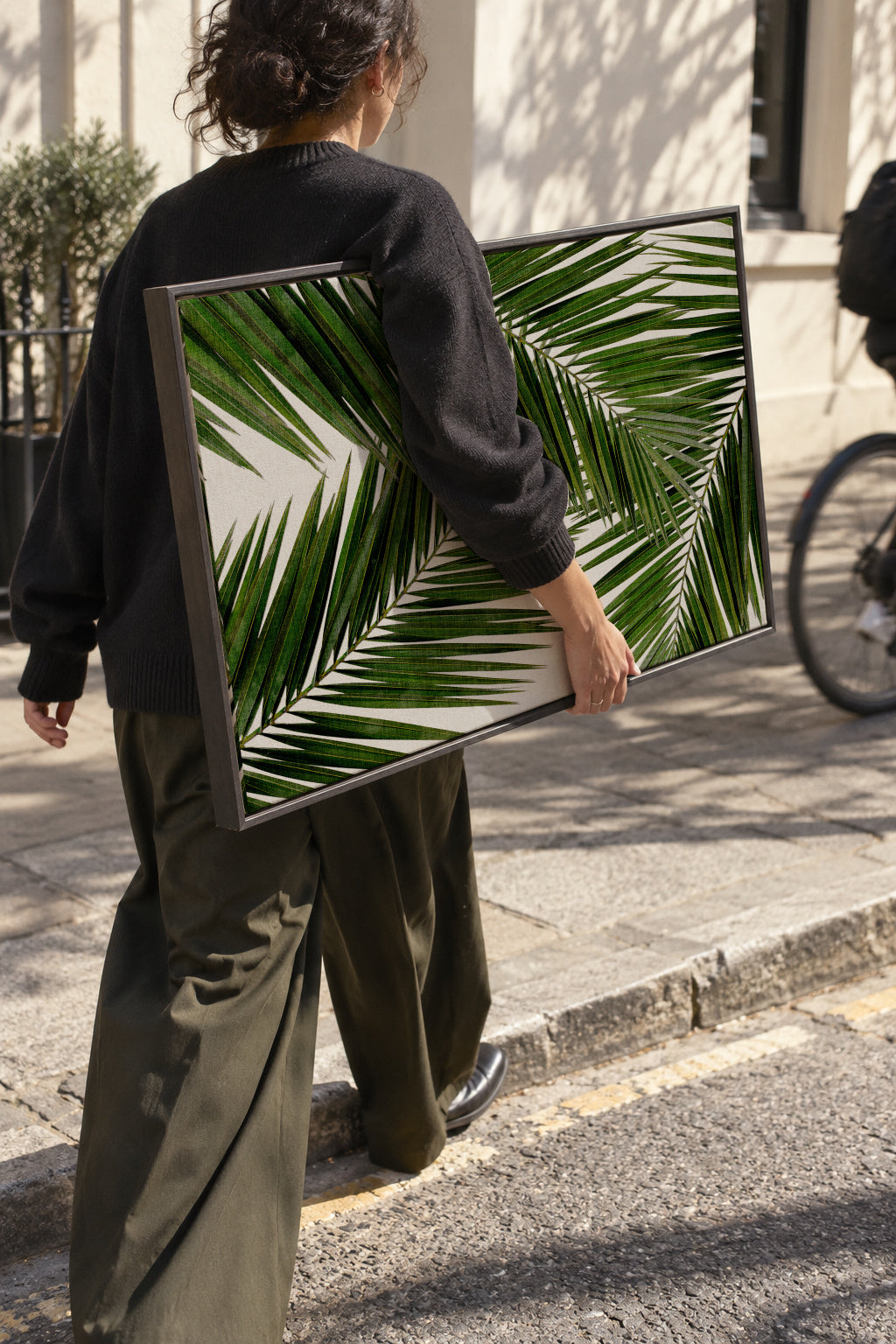 Palm Leaf III - Framed canvas in an interior