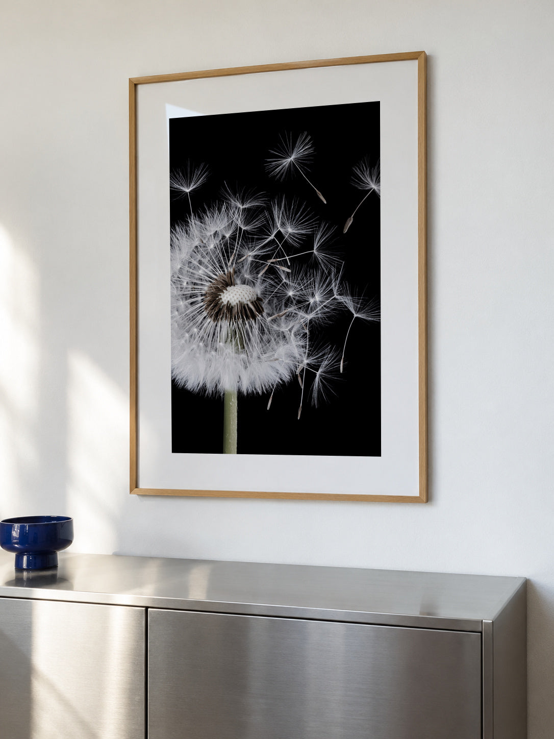 Dandelion Blowing - Framed poster in an interior