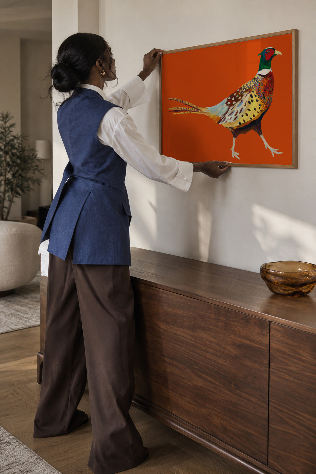 Strutting Pheasant On Orange - Framed poster in an interior