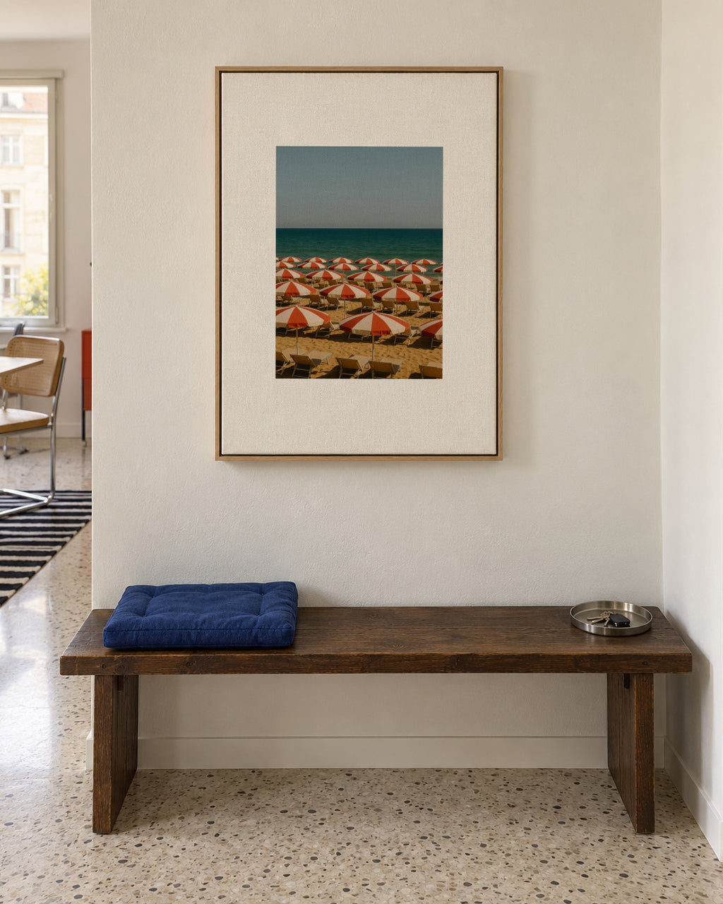 Red Umbrellas - Framed canvas in an interior